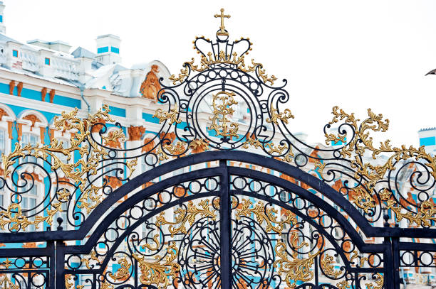 Located in the town of Tsarskoye Selo, or Pushkin, The Catherine Palace is a Rococo palace, once the summer residence of the Russian tsars. The entrance gates are as ornate as the oppulent and ostentatious interior of the palace, built by Catherine 1 of Russia.  It is located 30 km south of St. Petersburg, Russia.