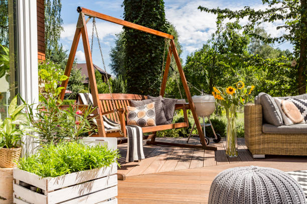 istock House patio with the garden swing 823369692