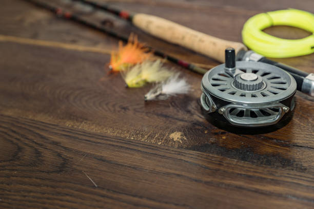 istock net, fishing rod, set by river 823374798