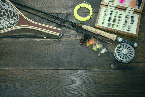 istock net, fishing rod, set by river 823374912