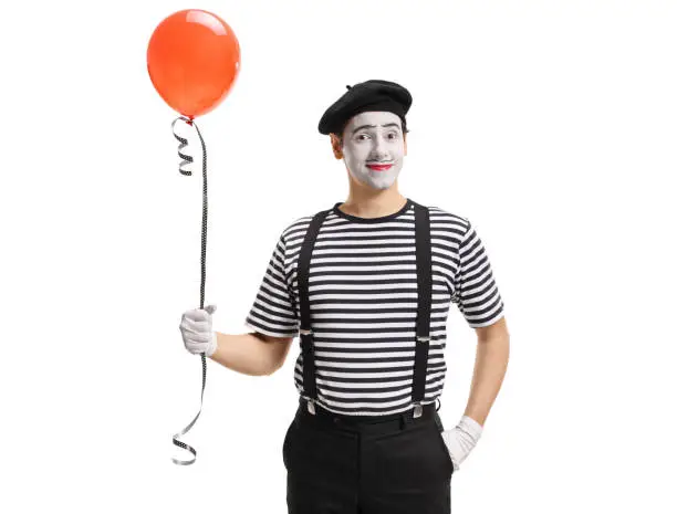 Mime artist with a balloon isolated on white background