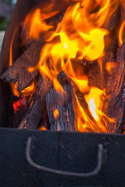 istock burning coals and flames background in the grill 823382804