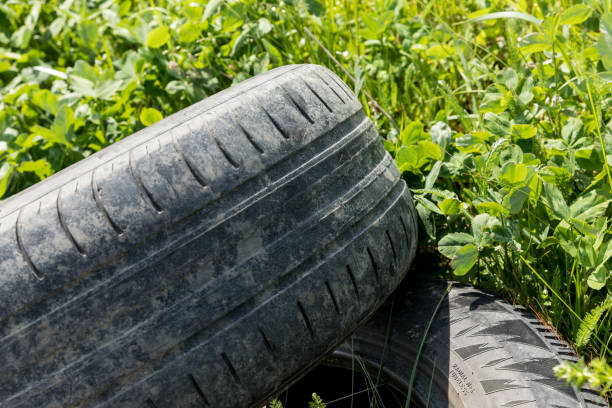 istock Old damaged tire are on the road. 823385980