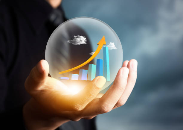 istock businessman holding increasing graph in crystal ball 823386674