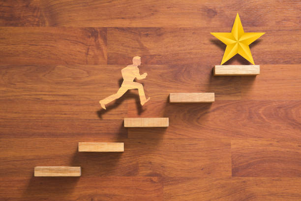 istock man running on stairs to success 823386728