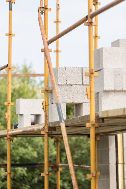 istock Scaffolding on building site with piles of blocks 823394544