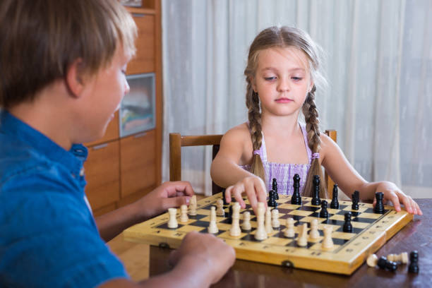 istock Children playing chess at home 823399676