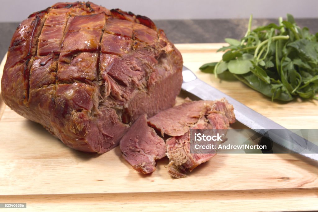 Gammon joint A gammon joint with watercress carved Bacon Stock Photo