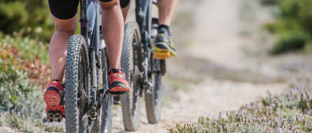 istock Couple cycling on mountain bikes 823413914