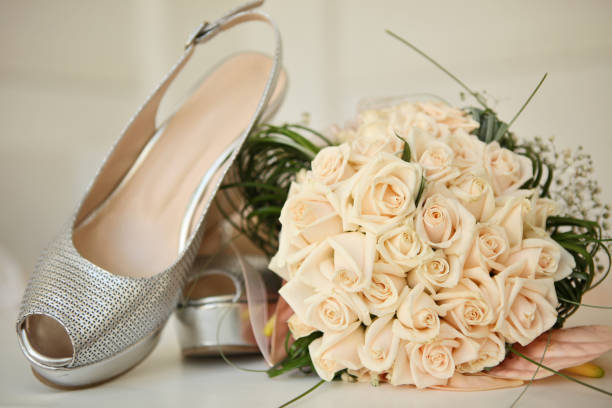 istock Beautiful wedding bouquet and bride's shoes 823417184