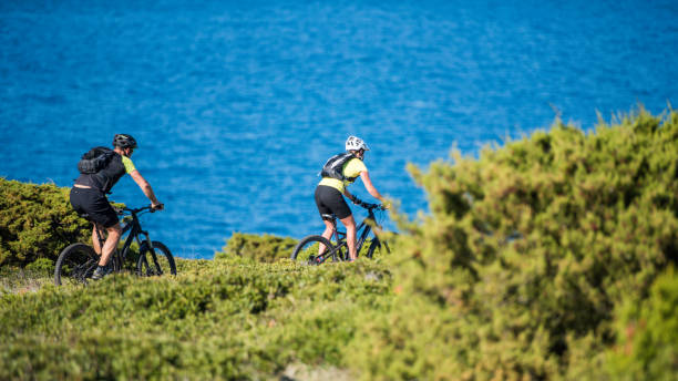 istock Cycling along a hill above coast 823417416