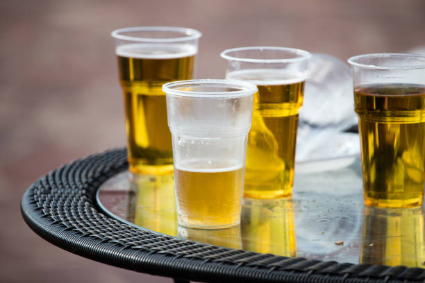 istock Beer in a plastic glass on the table 823426406