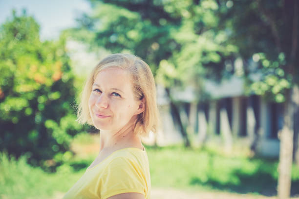 Caucasian woman outdoors portrait. Europe. Nikon, outdoor photography. No logos.