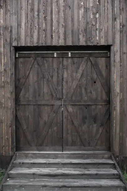 Photo of Countryside aged old farm barn gates closeup