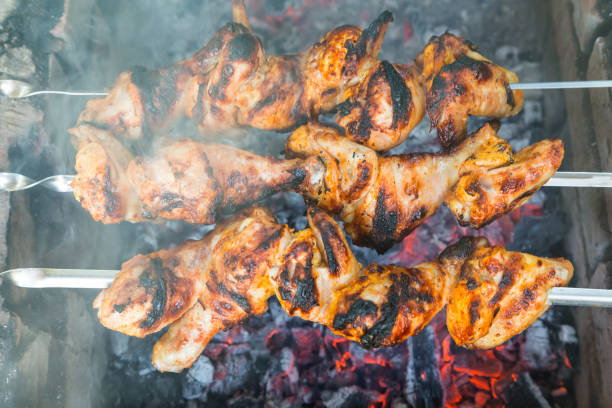 istock Chicken shish kebab roasting on the coals 823429022