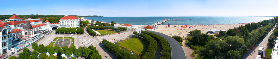 Sopot, Poland - August 28, 2017: Wide panorama of Sopot resort in Poland in summer, with beach, pier (Molo), Gdansk Bay, promenades, hotels, restaurants, fountain and vacation infrastructure