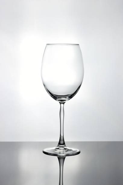 istock Tall empty isolated curved wine glass with a tall thin stem 823441292