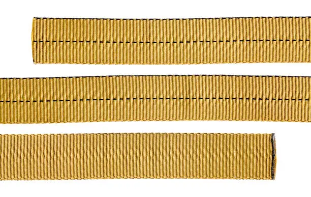 nylon tubular webbing for climbing, mountaineering, industrial work, and rescue, three pieces isolated on white