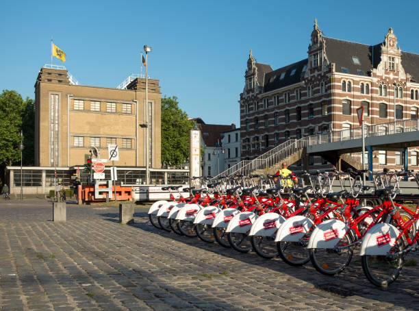 Antwerp City bikes in front of the entry building to the Sint-Anna Pedestrian Tunnel. Antwerp City  bikes in front of the entry building to the Sint-Anna Pedestrian Tunnel, Tuesday 13 June 2017, Antwerp, Belgium. linker stock pictures, royalty-free photos & images