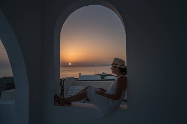 Woman at sunset in Santorini