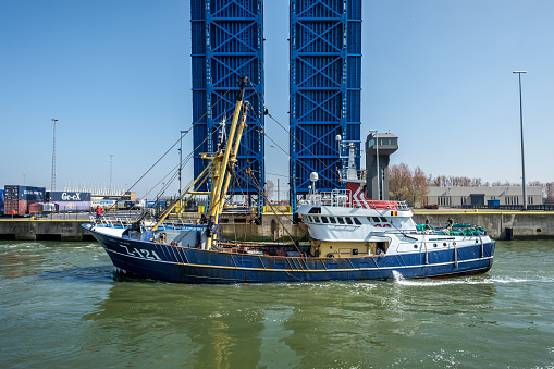 Fishing boat sailing through the lock (Pierre Vandammesluis), Sunday 9 April 2017, Zeebrugge, Belgium