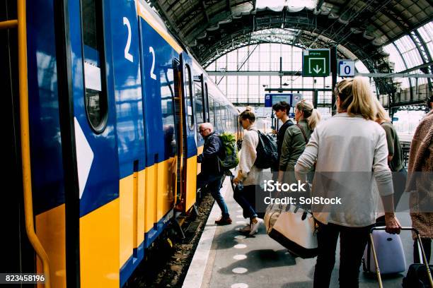 Friends Catching The Train In Amsterdam Stock Photo - Download Image Now - Train - Vehicle, Netherlands, People