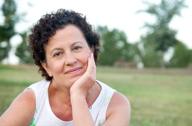 istock Woman in the park portrait 823458908