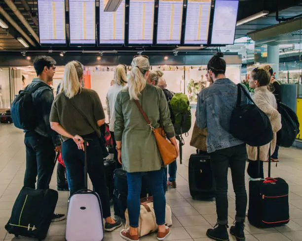 Tourists in Amsterdam waiting at the airport.