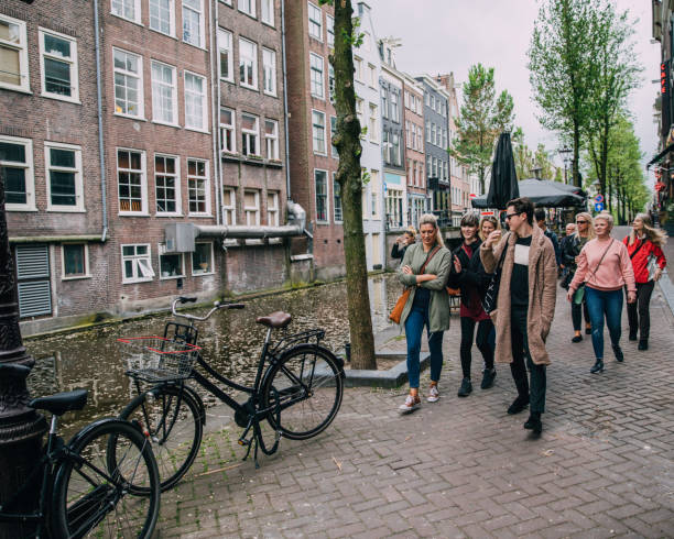 istock Friends Stroll by the Canal in Amsterdam 823460014