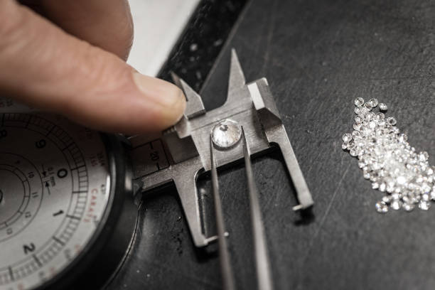 istock Professional gemstone settings jewellery craft laboratory: Choosing diamonds 823466136