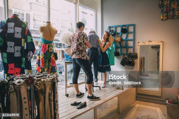 Dressing A Mannequin In A Shop Window Stock Photo - Download Image Now - Store Window, Store, Fashion