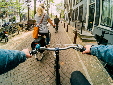 Viewpoint of a cyclist following his friends on their bicycles