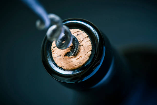 wine cork in bottle wine cork in bottle and corkscrew cork material stock pictures, royalty-free photos & images