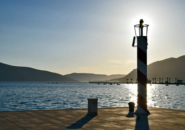 istock Lighthouse on the cape in the sunset 823493206
