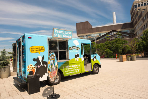 Boston, MA, July 3, 2017: Ben and Jerry's ice cream truck parked in a lot on the Harvard University Campus on July 4th weekend. Harvard allows visitors in for tours all year round, even on holidays.