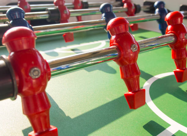 istock Table football game with red and blue players team 823497192