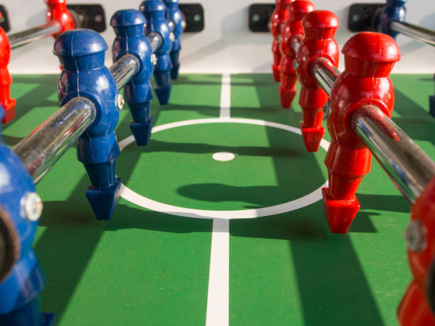istock Table football game with red and blue players team 823497248