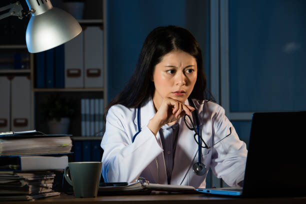 istock worried doctor having bad diagnosis at night 823502226