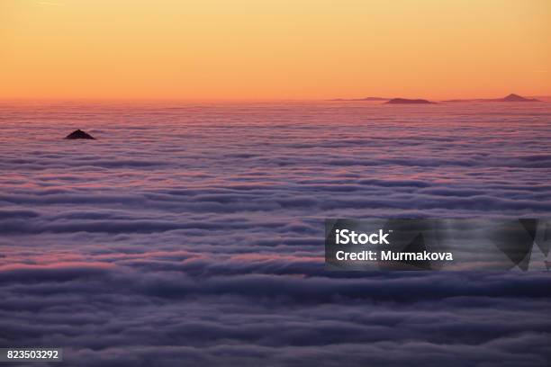 Inversion Over The Valley Orangecolored Sky And Clouds Stock Photo - Download Image Now