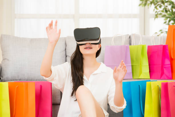 istock asian woman experience shopping online with VR headset 823506470