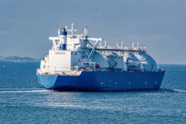 Liquefied natural gas (LNG) tanker is passing by Strait of Singapore.