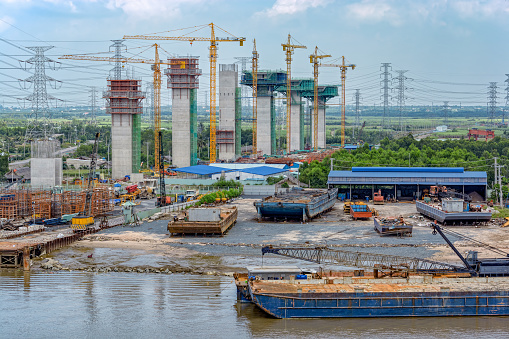 A bridge under construction over the river Saigon (Song Sai Gon). Vietnam, Southeast Asia