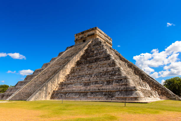 istock El Castillo (Temple of Kukulcan),  a Mesoamerican step-pyramid, Chichen Itza. It was a large pre-Columbian city built by the Maya people of the Terminal Classic period. UNESCO World Heritage 823511434