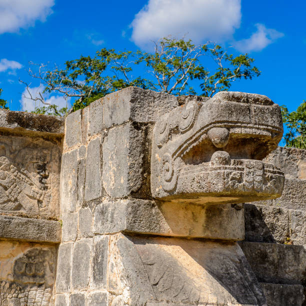 istock Plumed Serpent, Venus Platform, Chichen Itza, Tinum Municipality, Yucatan State. It was a large pre-Columbian city built by the Maya people of the Terminal Classic period. UNESCO World Heritage 823514280