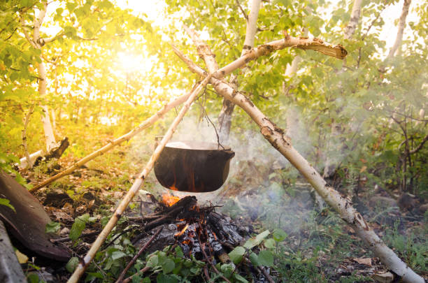 istock Cauldron on a birch branch. Tourist food. 823515764