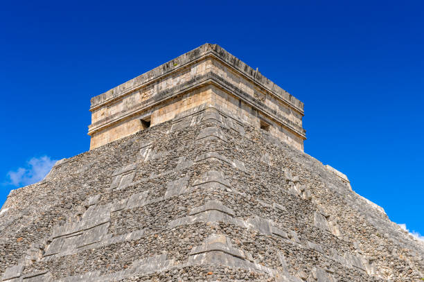 istock El Castillo (Temple of Kukulcan),  a Mesoamerican step-pyramid, Chichen Itza. It was a large pre-Columbian city built by the Maya people of the Terminal Classic period. UNESCO World Heritage 823524036
