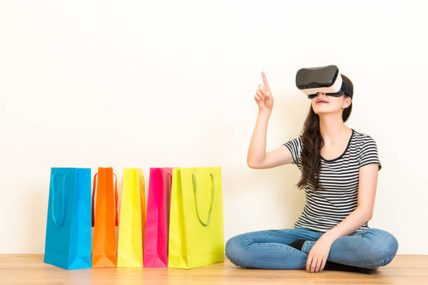 istock woman virtual reality equipment online shopping 823525794