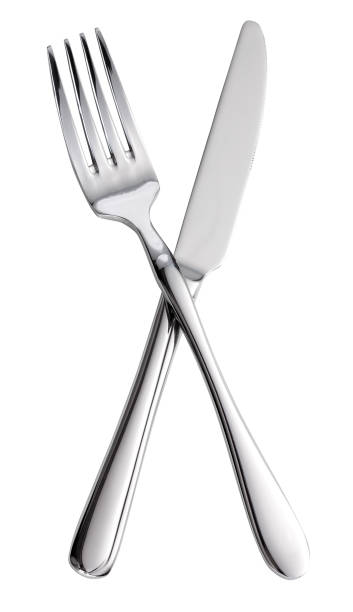 Fork and knife crossed. Isolated on a white background. stock photo