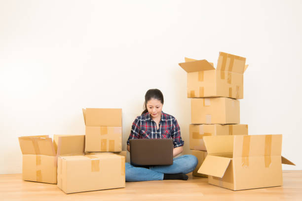 istock woman moving and using laptop 823528542