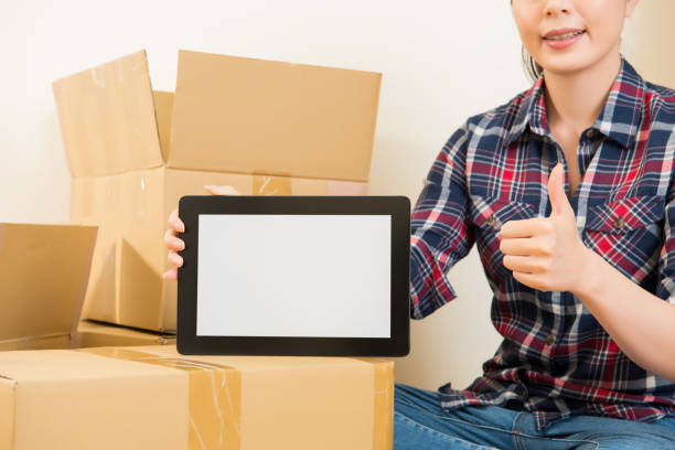 istock thumbs up for moving house with digital tablet 823528862